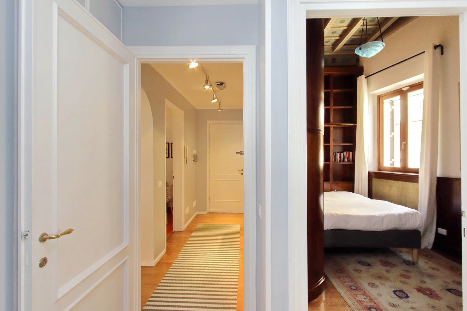 Hallway view to front door, bedroom 2 on the right