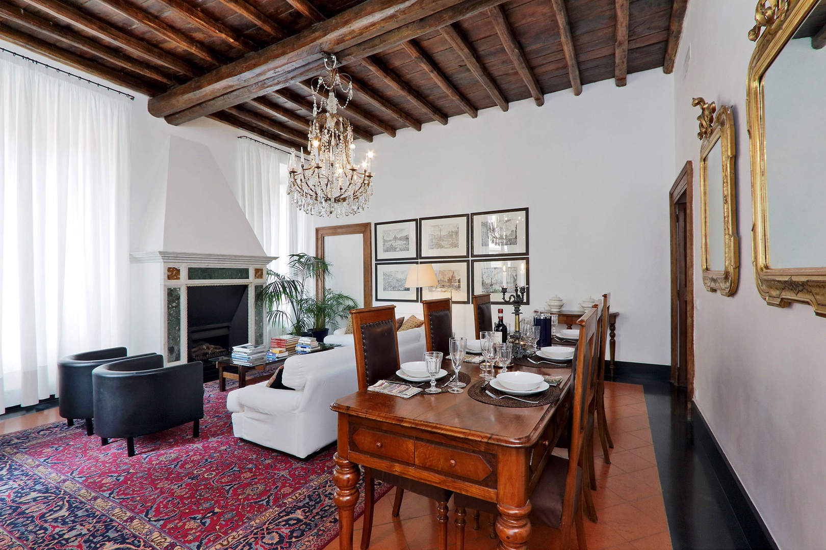 More views of the living room and dining area with lovely high beamed ceilings.