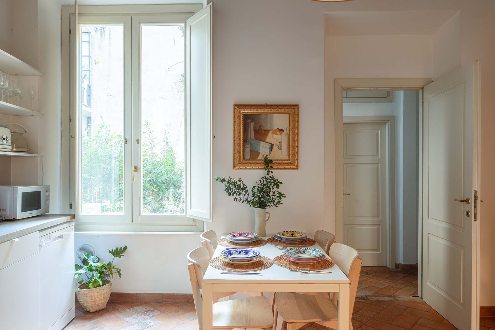 Large and bright kitchen features a dining area.