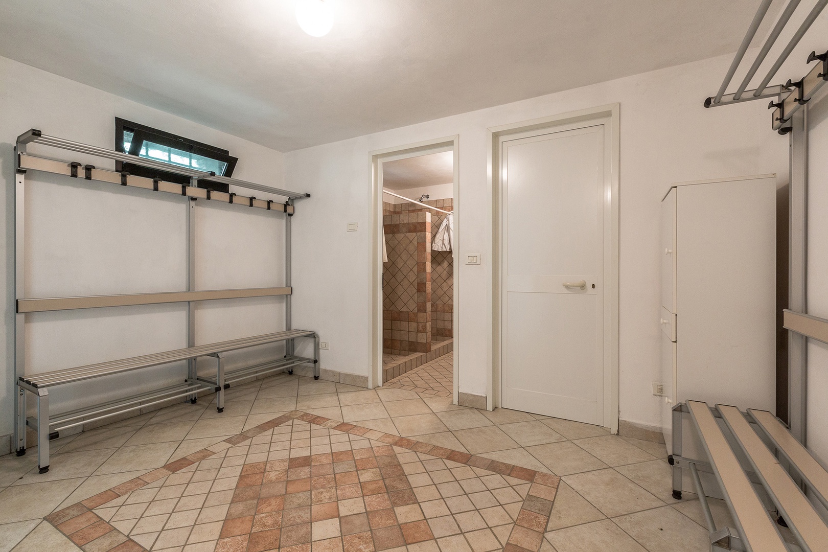 Changing room and full bathroom in the pool house below the pool.