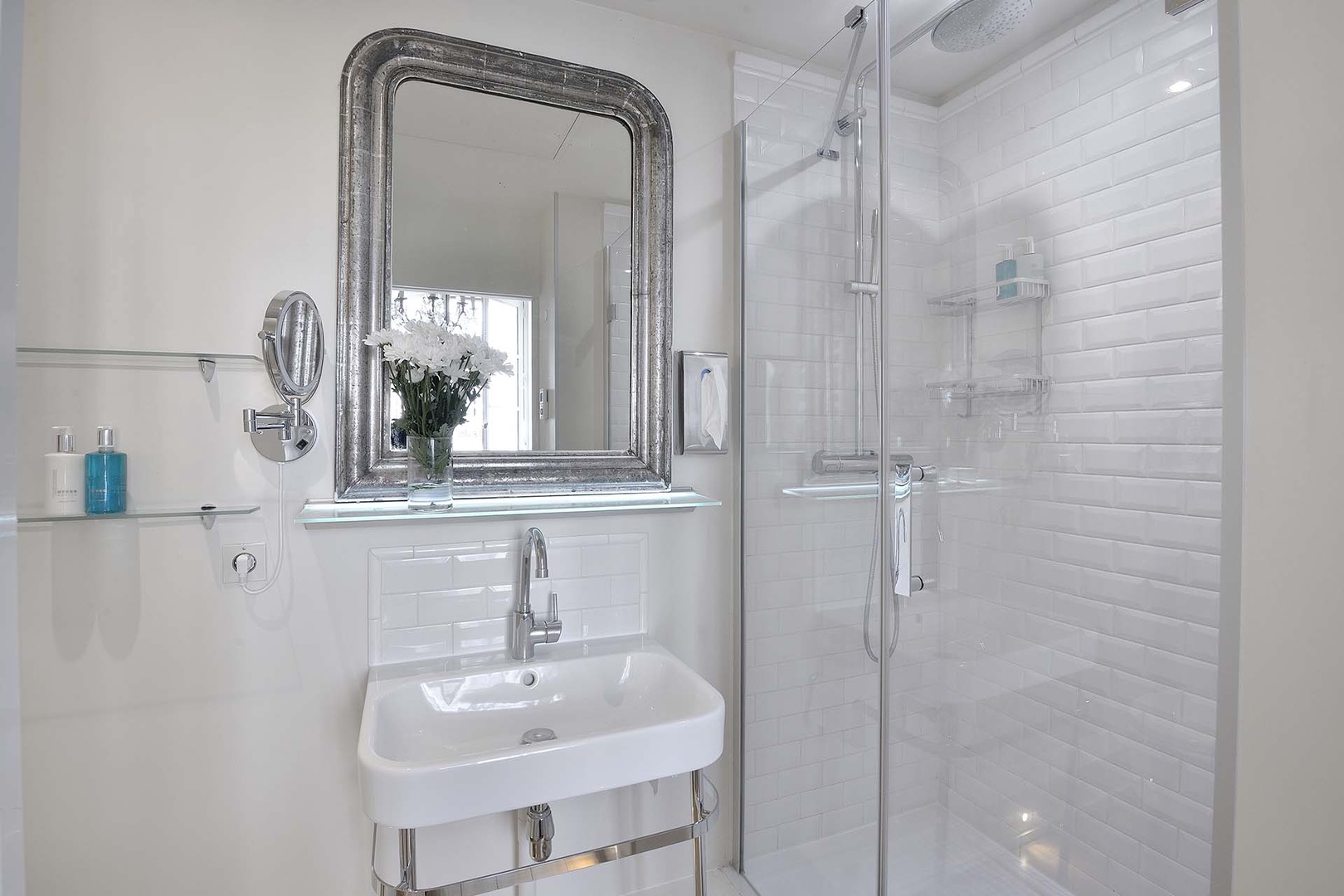The modern en suite bathroom has a shower, toilet and sink.