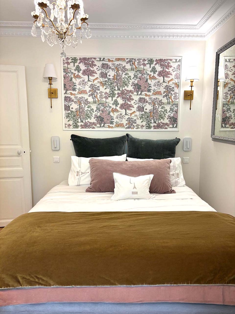 Luxurious bedroom 1 has beautiful Parisian inspired decor.