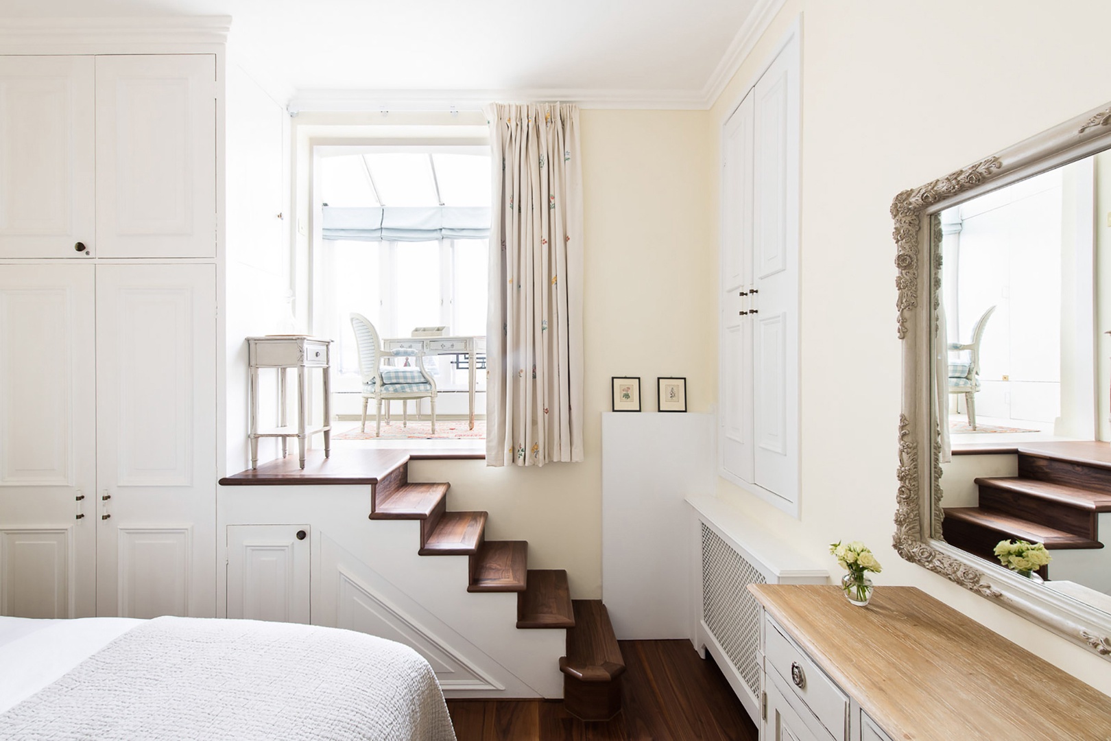 The sunroom fills the bedroom with light.