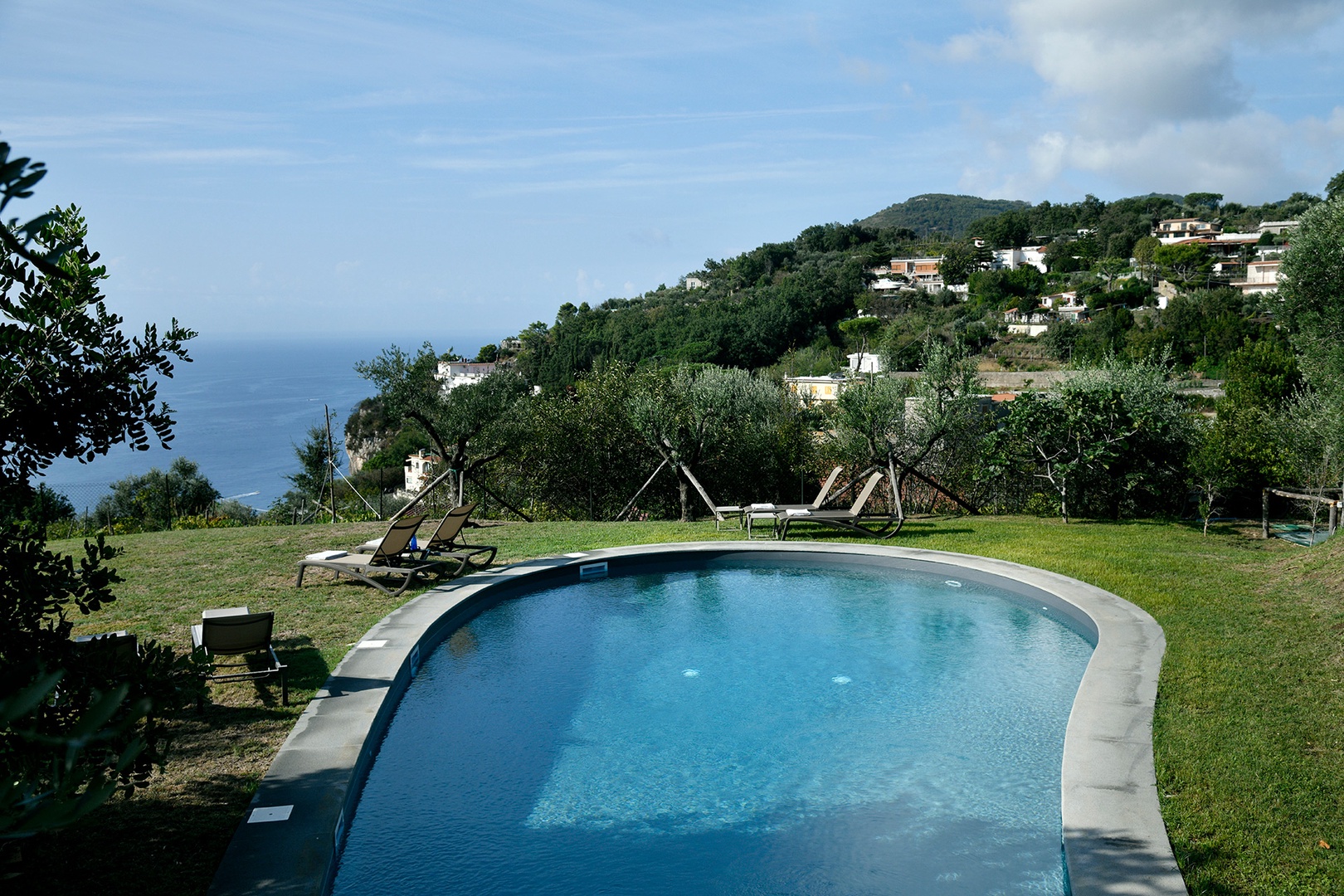 Lounge by the pool while enjoying magnificent views