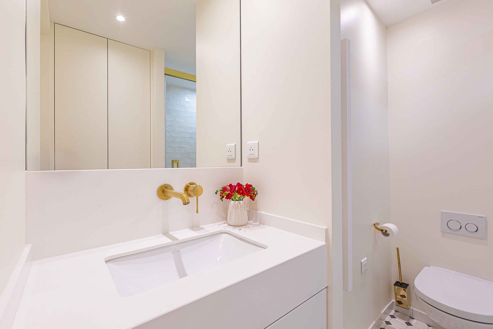 Bathroom 2 with shower, toilet and sink.