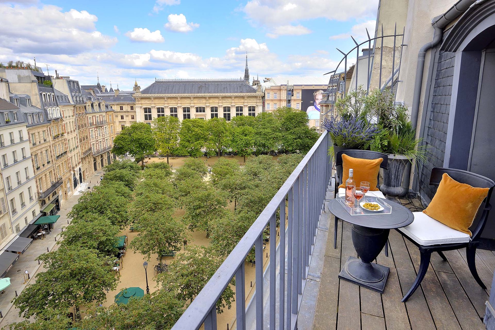 Enjoy your private balcony with a beautiful view of Place Dauphine !