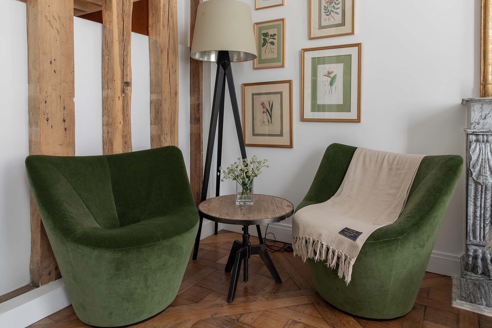Two chic sitting chairs create a cozy corner.