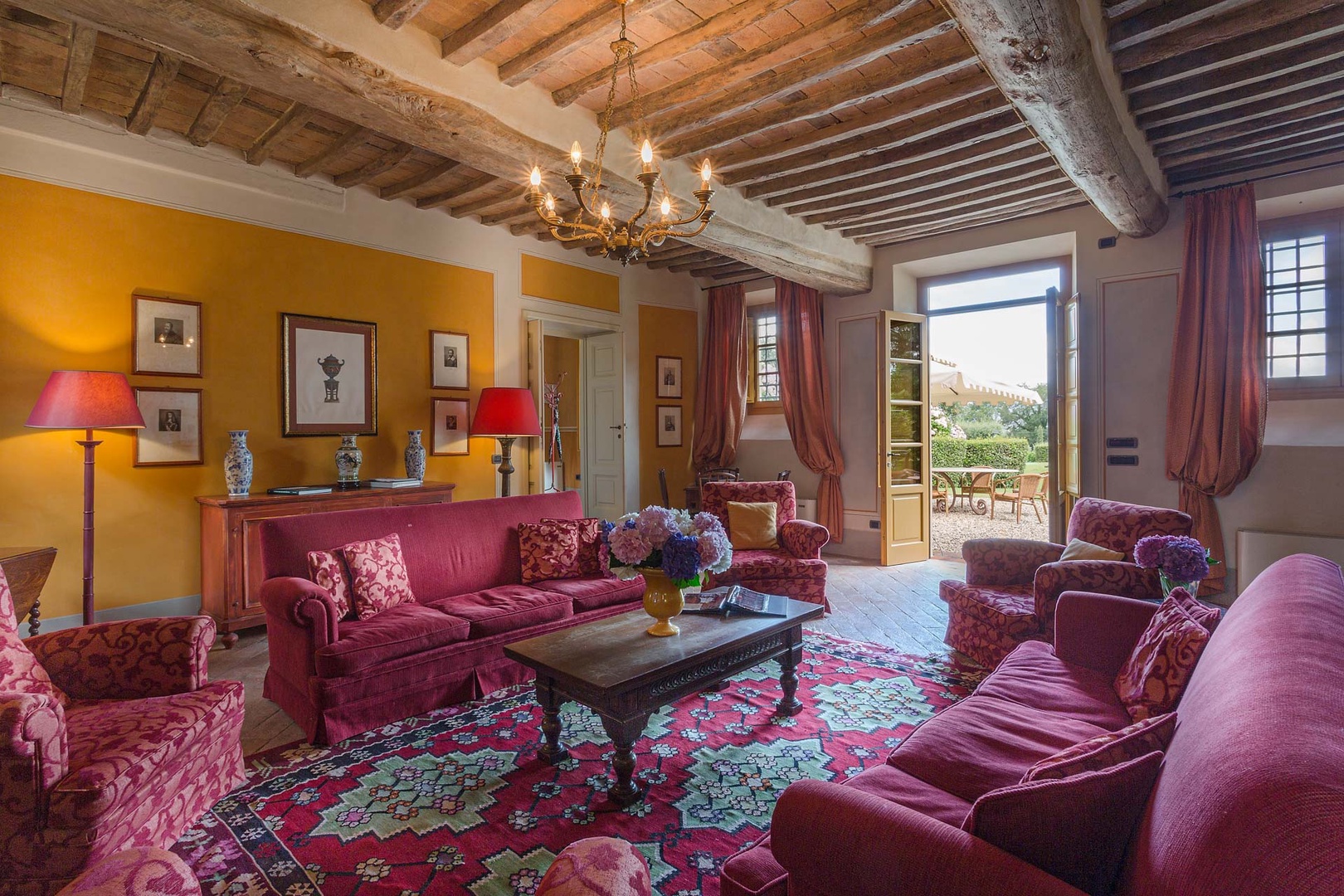 Cozy living room with traditional, warm prints on soft furnishings