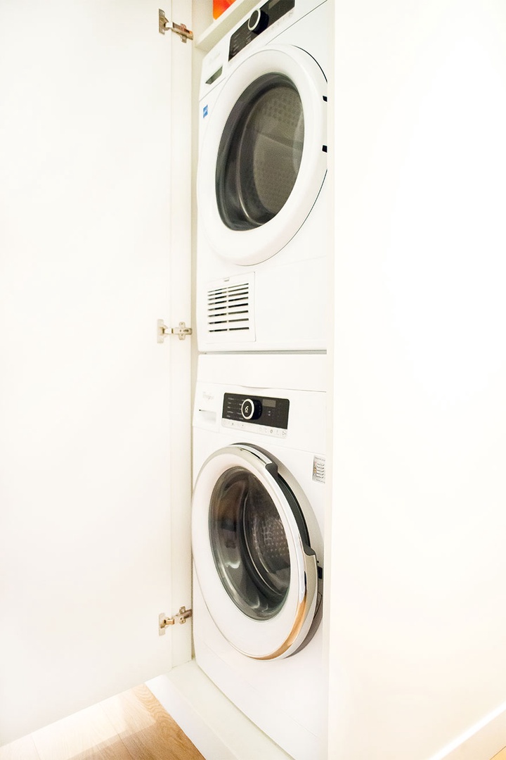 Separate washing machine and dryer in the hallway