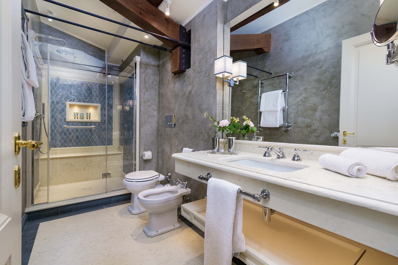 En suite bathroom 3 with large shower, toilet and sink.