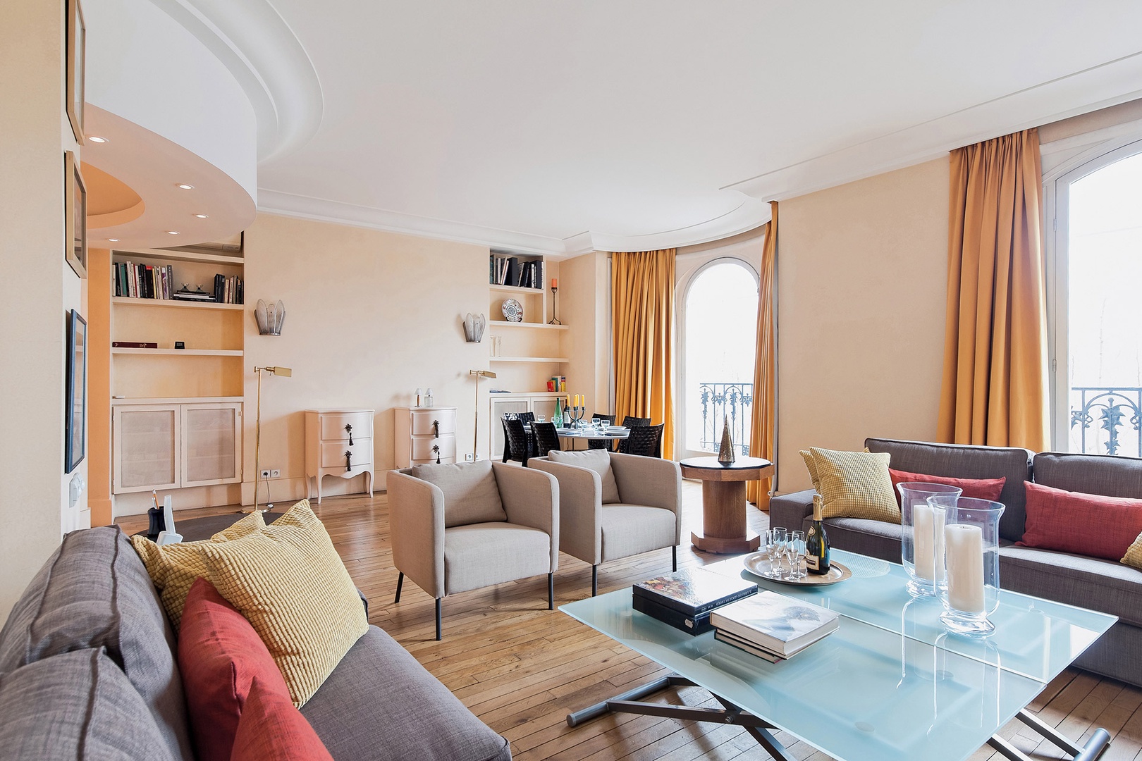 Large windows fill the living room with beautiful light.