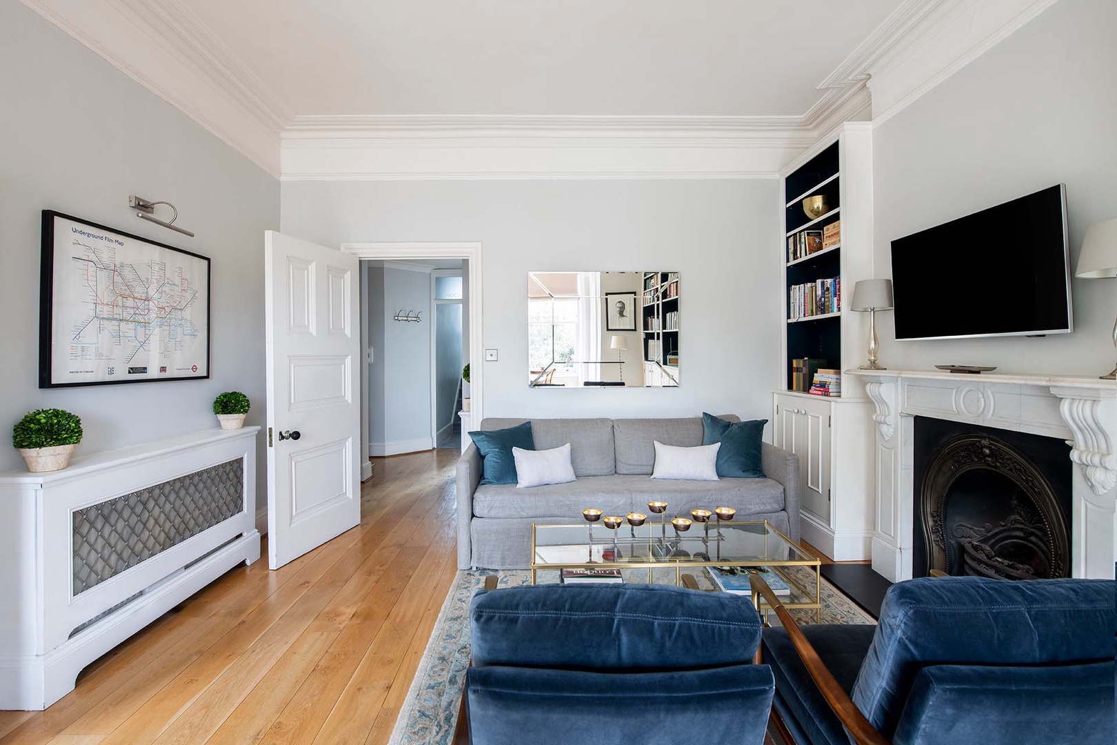 Comfortable living room with large flat-screen TV.