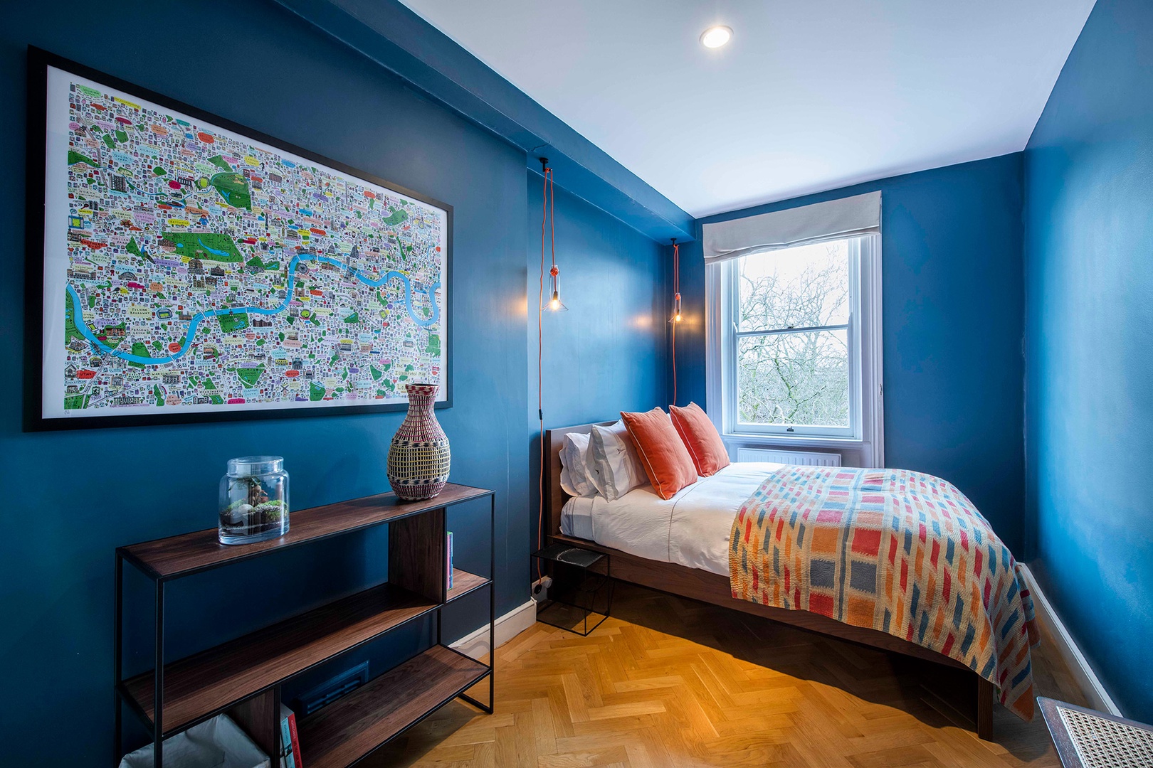 Bedroom 2 is a tranquil retreat in a soothing azure shade