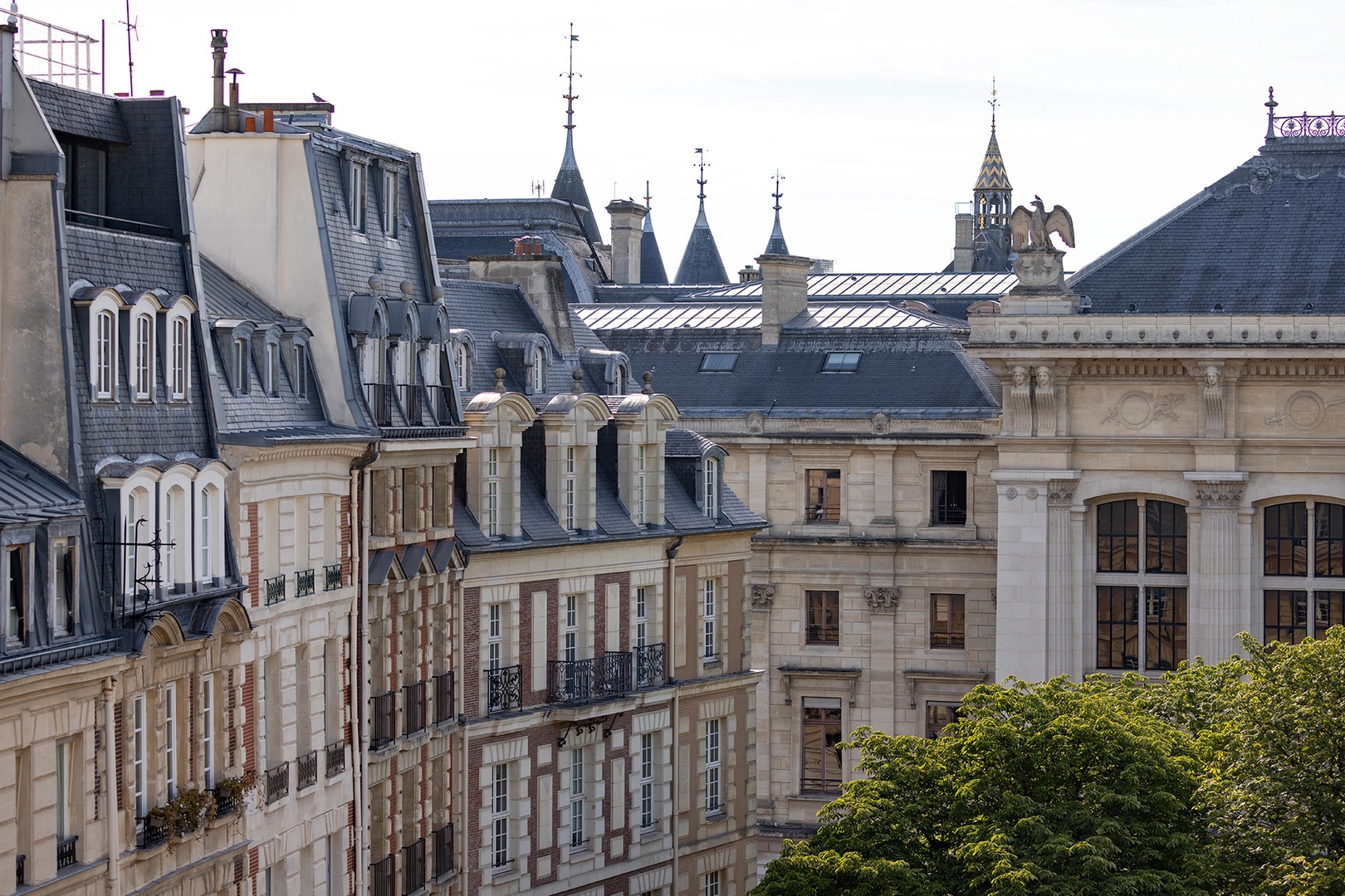 Views of the rooftops surrounding Place Dauphine and the spires of Conciergerie.