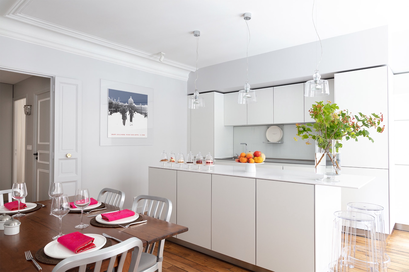 The open-plan dining table and modern kitchen are perfect for entertaining.