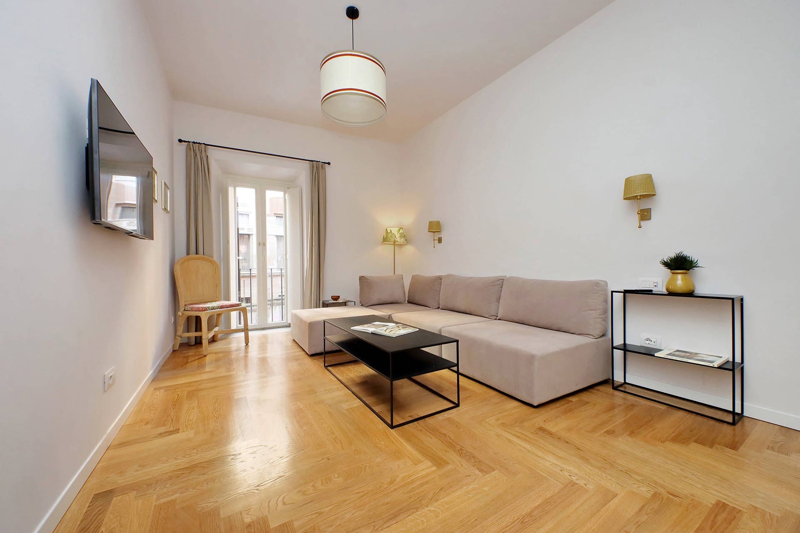 Bright and roomy living room lends space to relax and unwind.