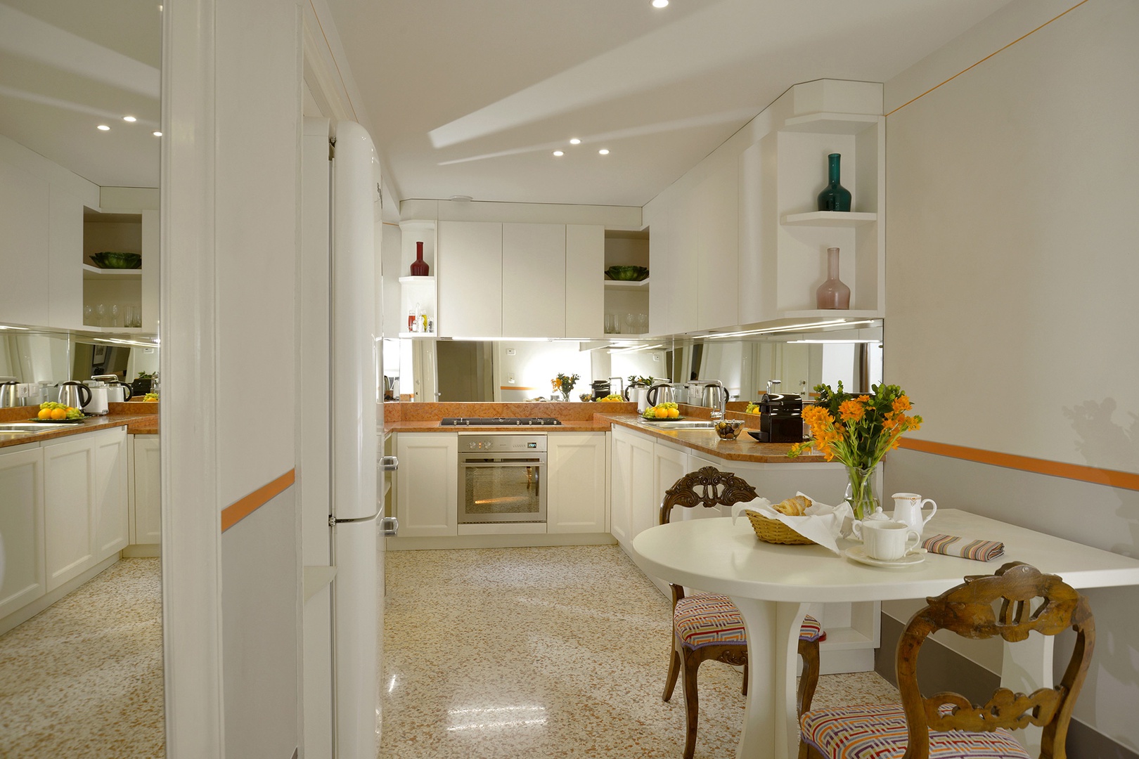 Full kitchen with breakfast table.