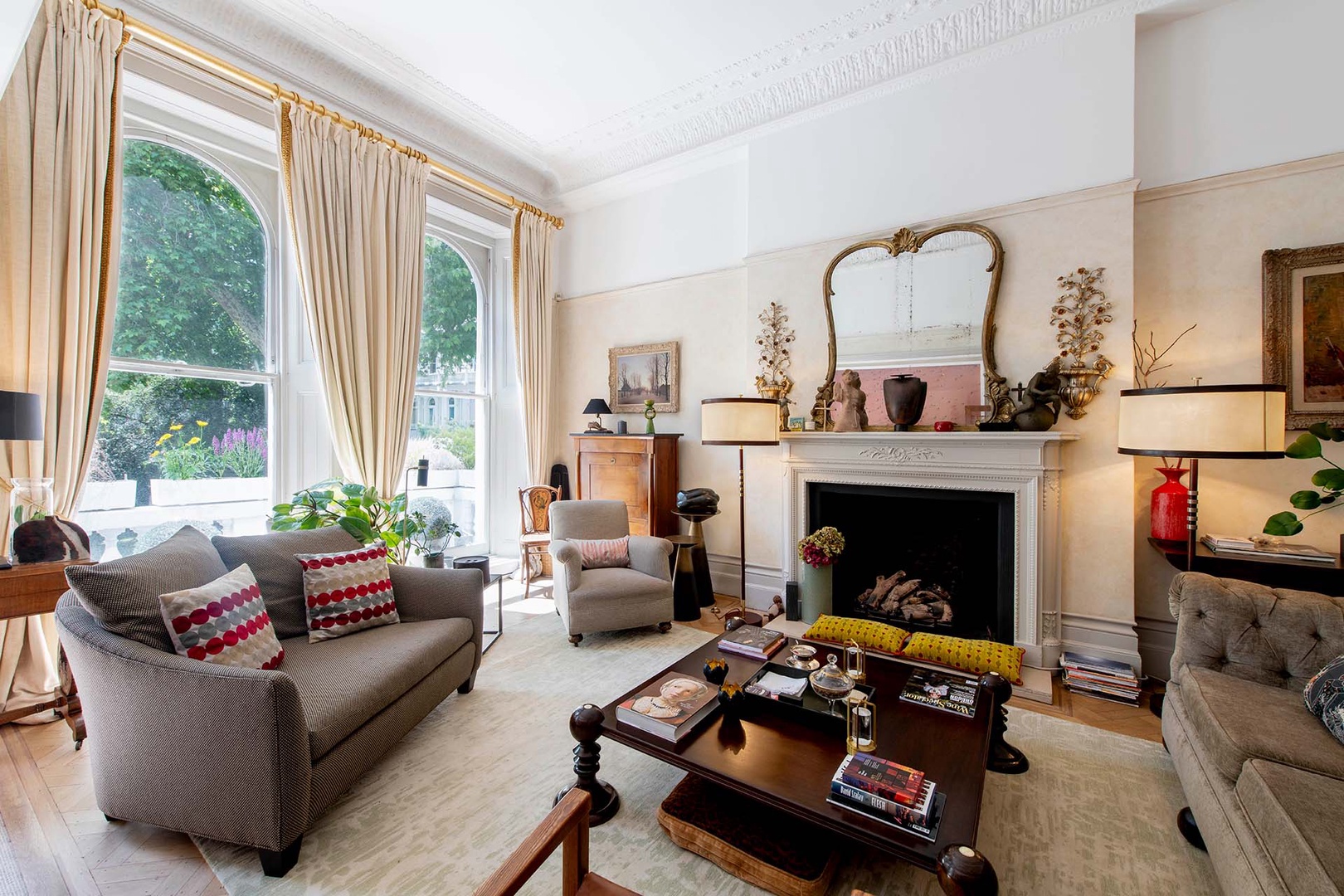 Large windows fill the living room with light.