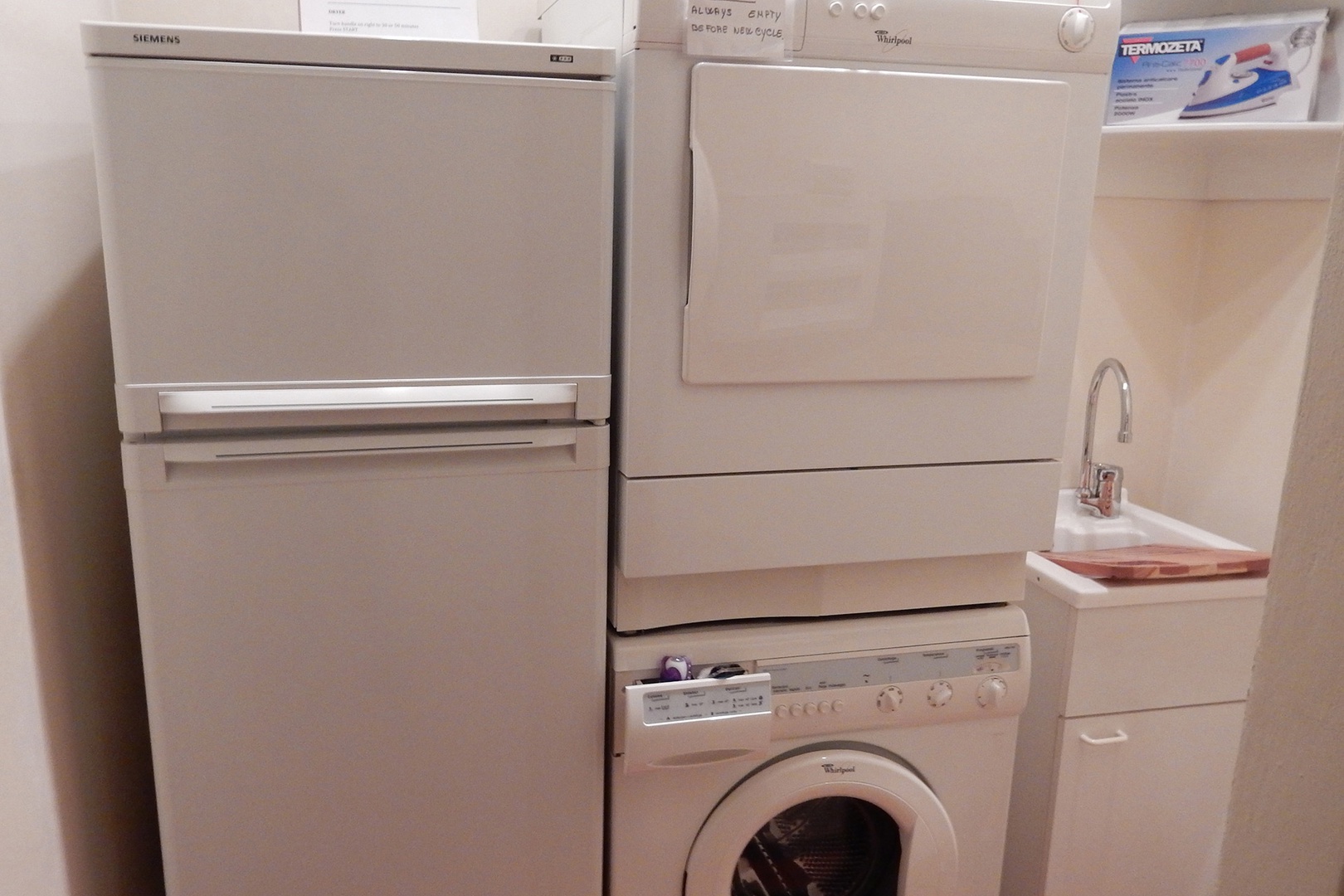 Refrigerator, washer and dryer in apartment.