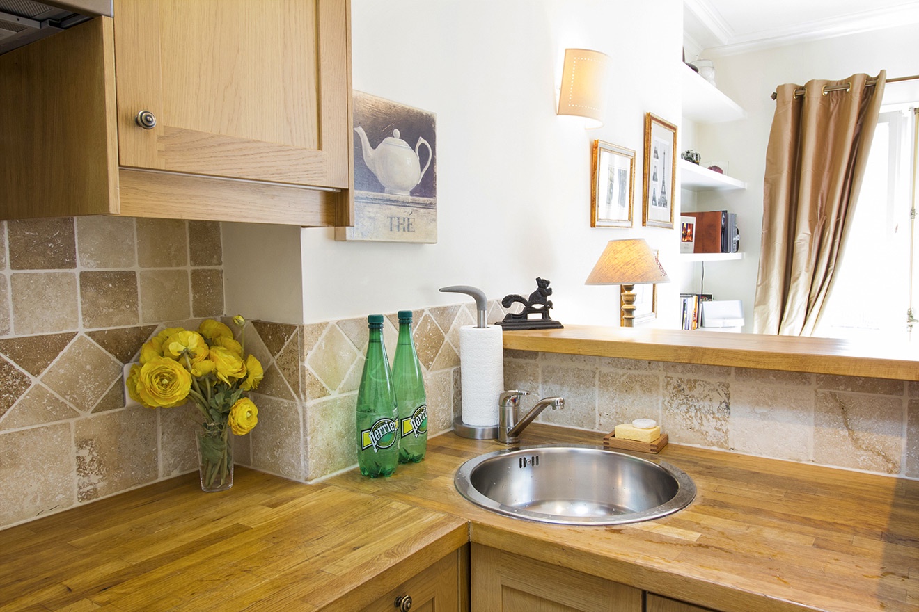 The kitchen has been cleverly designed to maximize space.