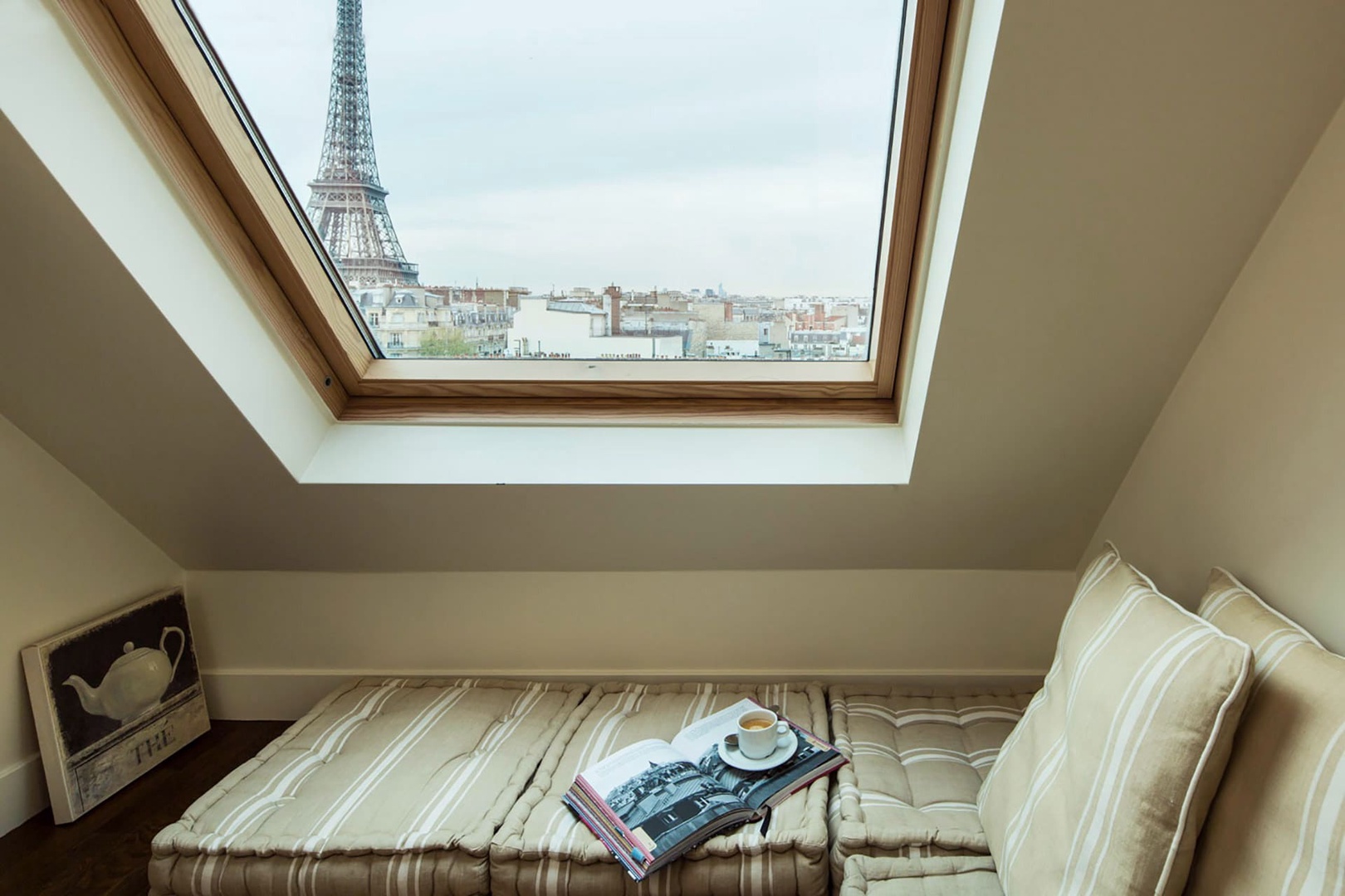 Enjoy beautiful Eiffel Tower views from the seating gallery of bedroom 2.