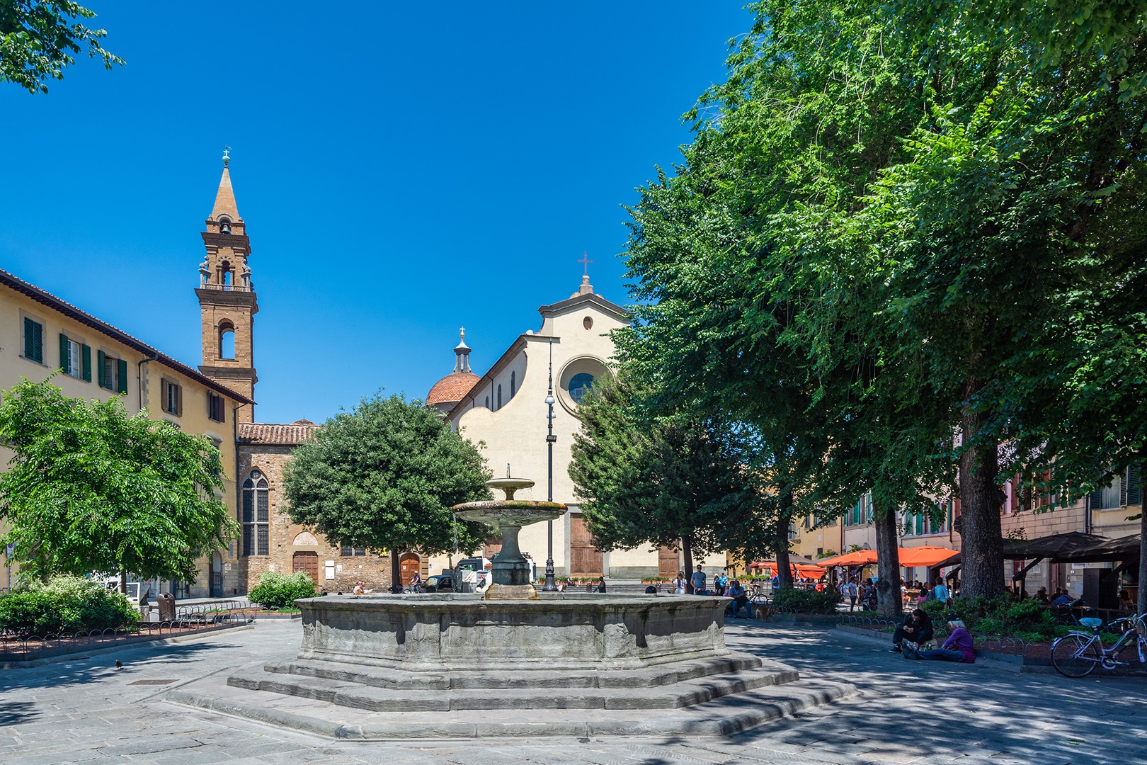 Piazza Santo Spirito is surrounded by restaurants and hosts a local market.