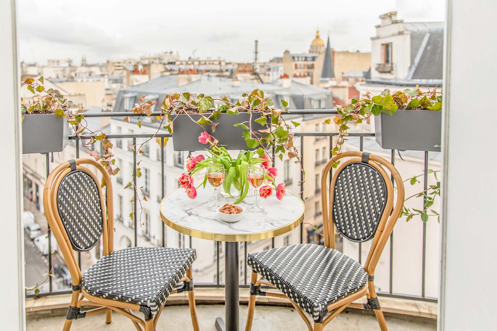 Dine indoors or step outside to find another charming balcony off the dining area.