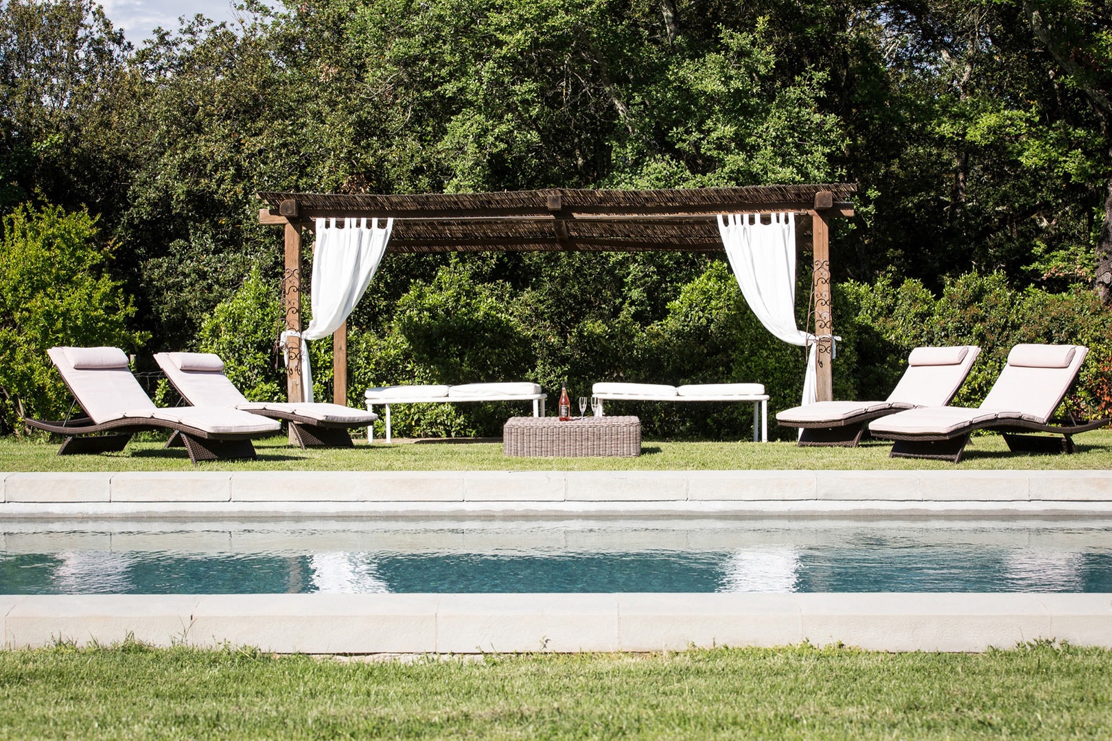 Shady pergola by the pool.