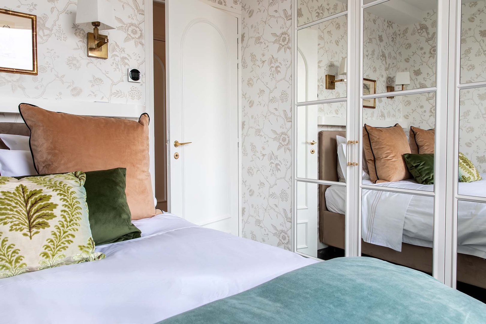 Mirrored wardrobes double the natural light.