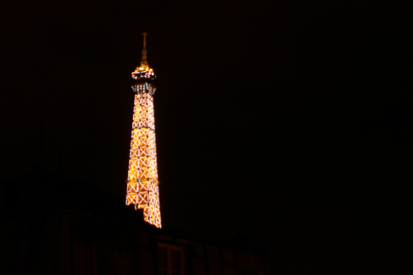 Catch the Eiffel Tower's golden glow at night from your apartment.