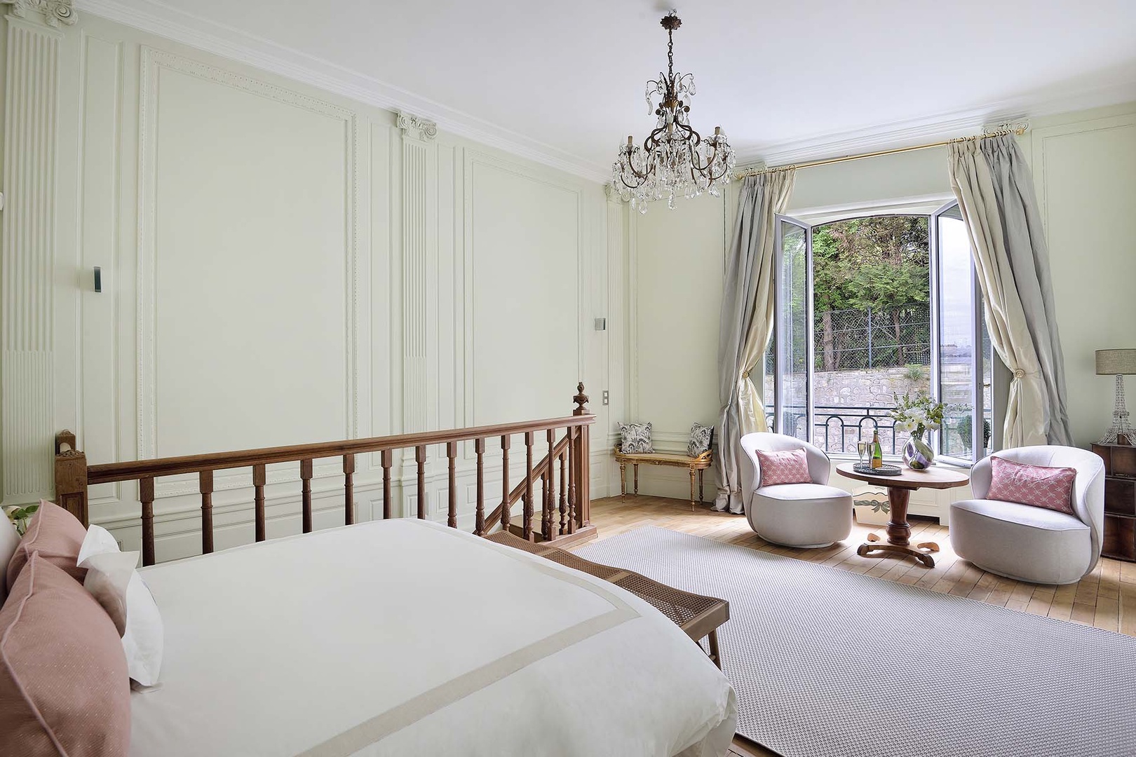 Large French door in bedroom with sitting area.