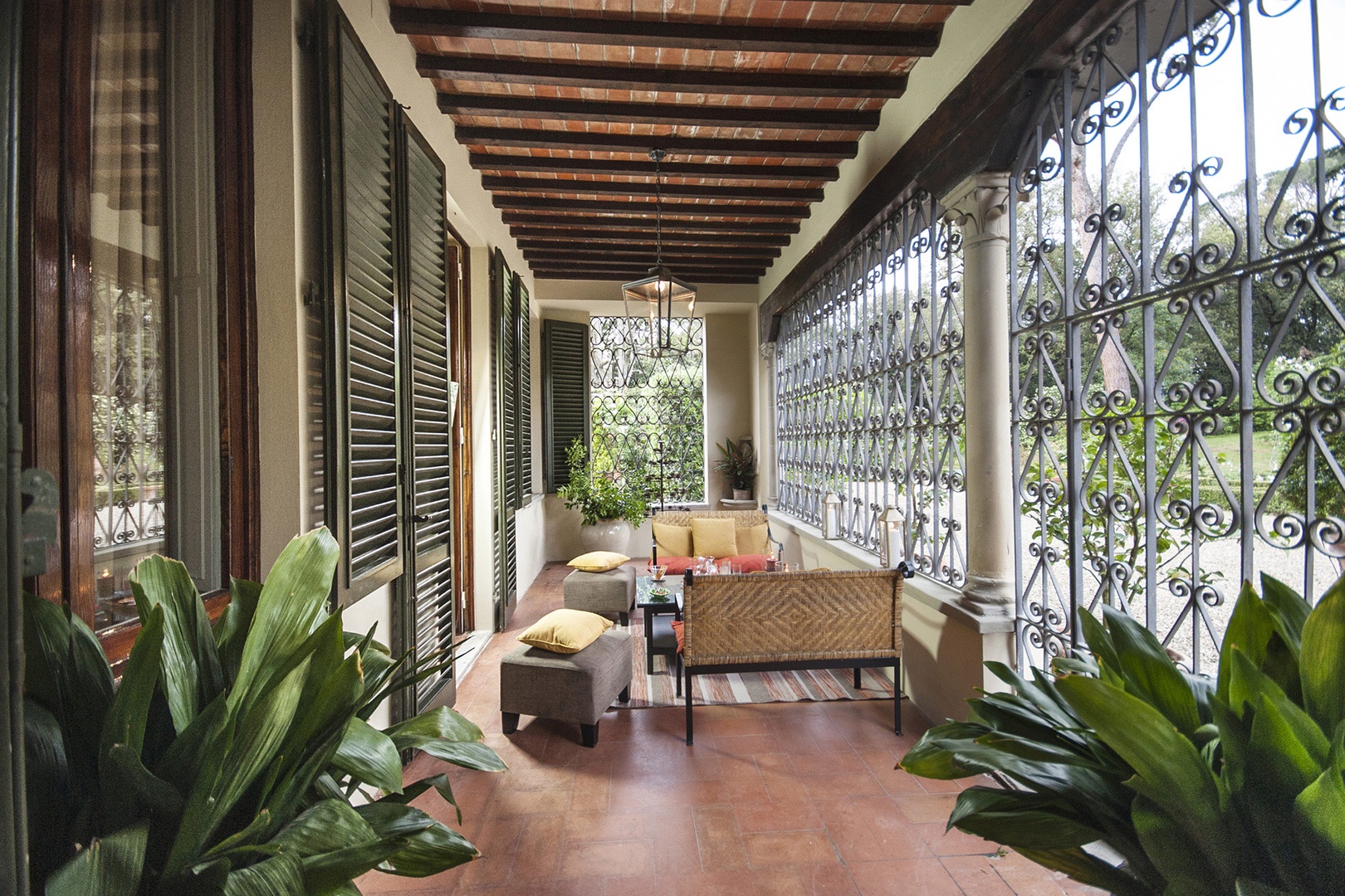 A beautiful loggia off the entry to the villa is perfect for lounging and relaxing.