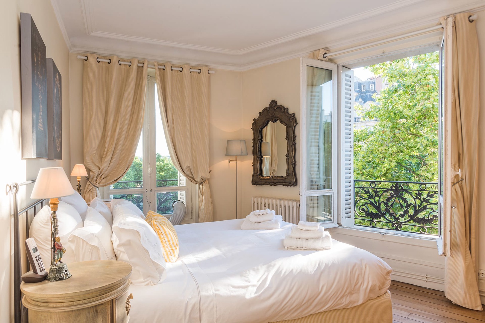 Step into the gorgeous French bedroom with a luxurious bed.