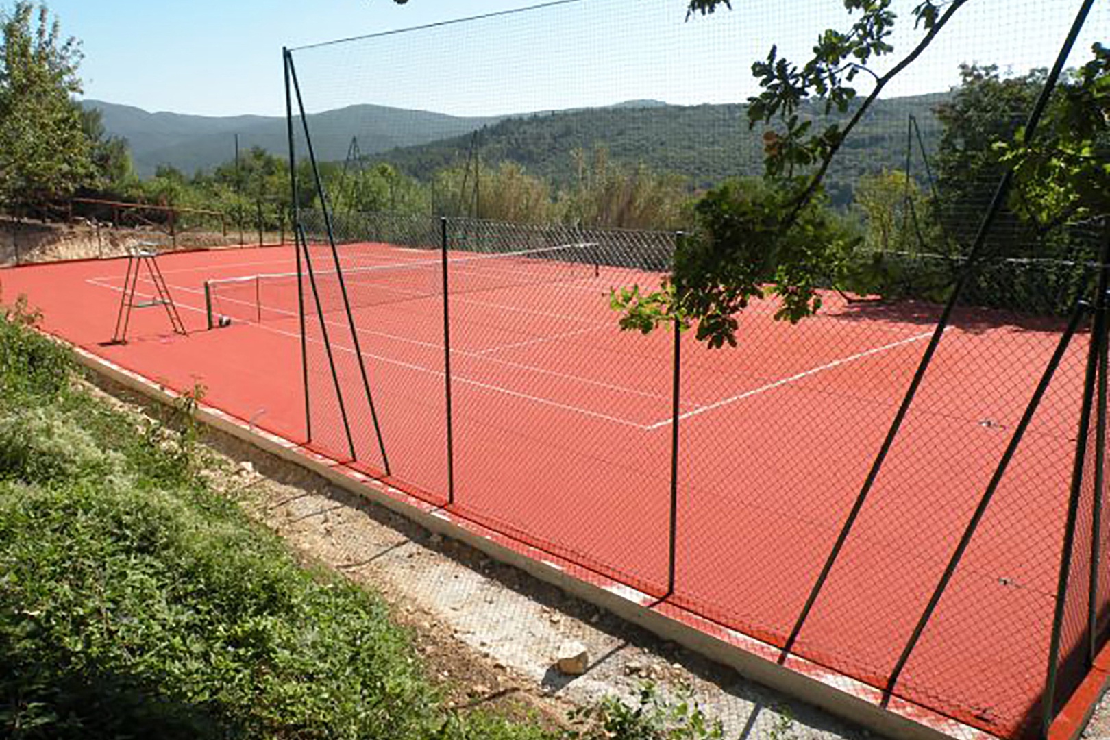 Play tennis on the private clay court.
