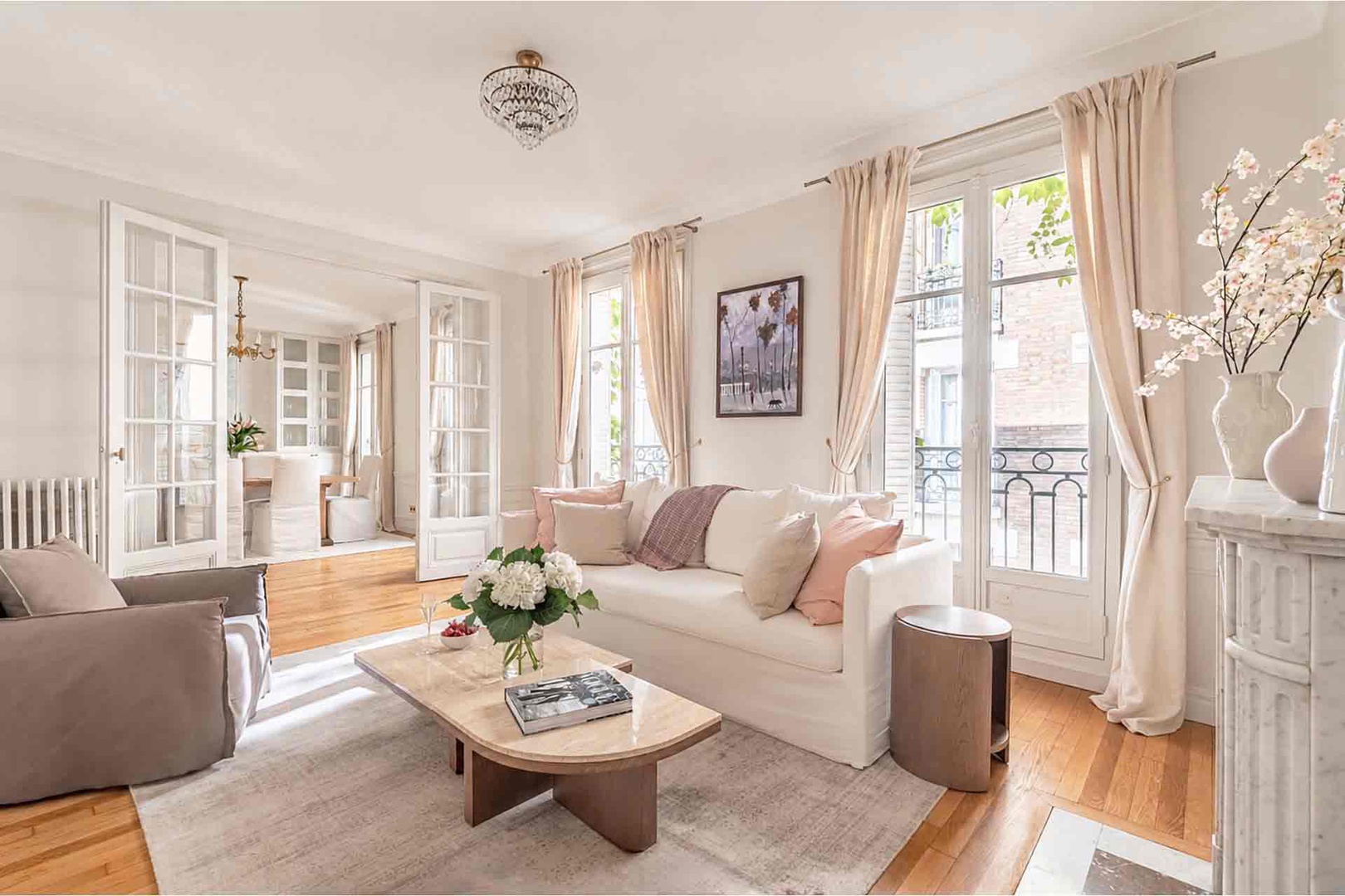 Three sets of large French doors in the living room and dining area.