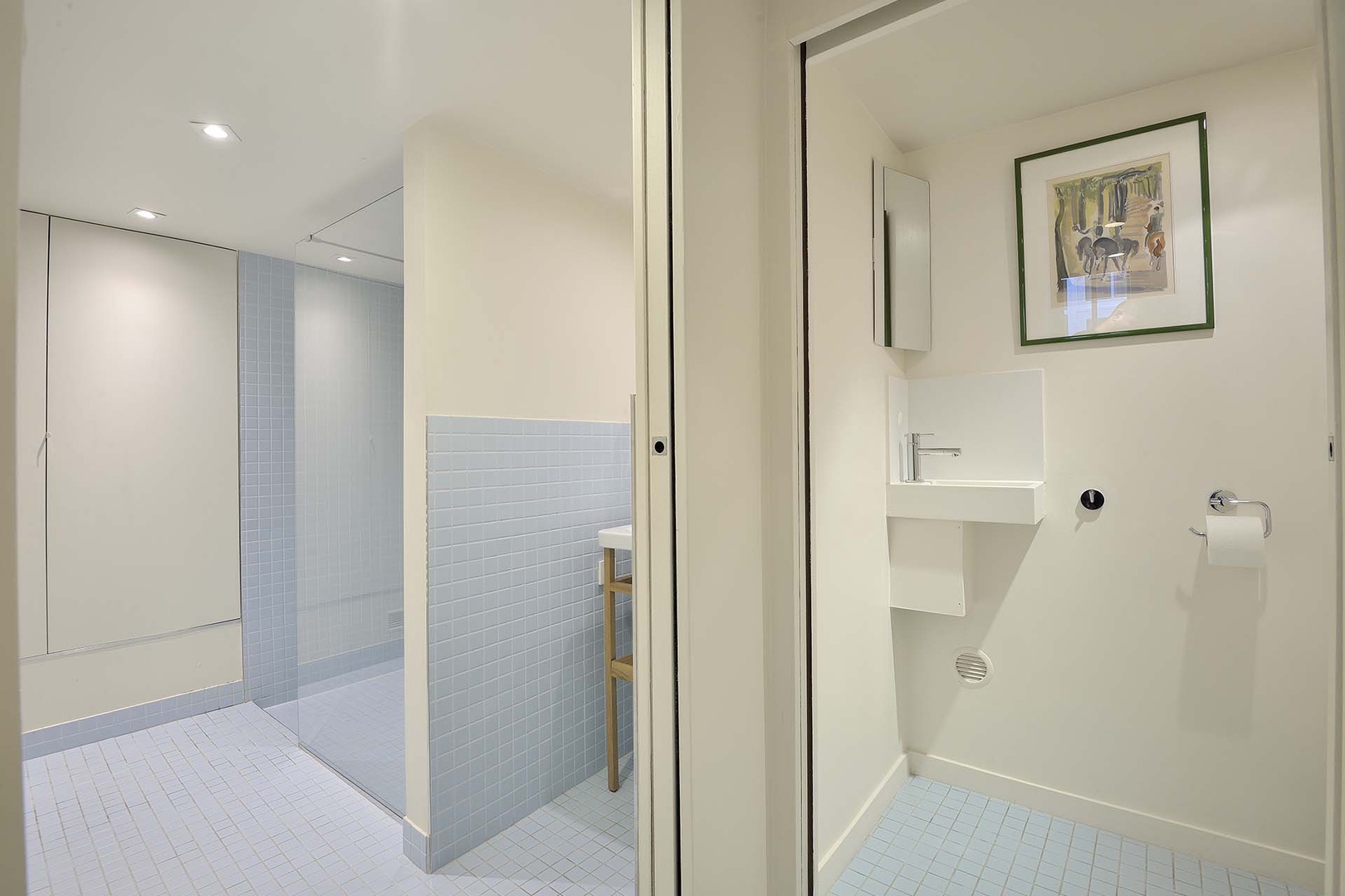 Bathroom is conveniently split into two rooms.