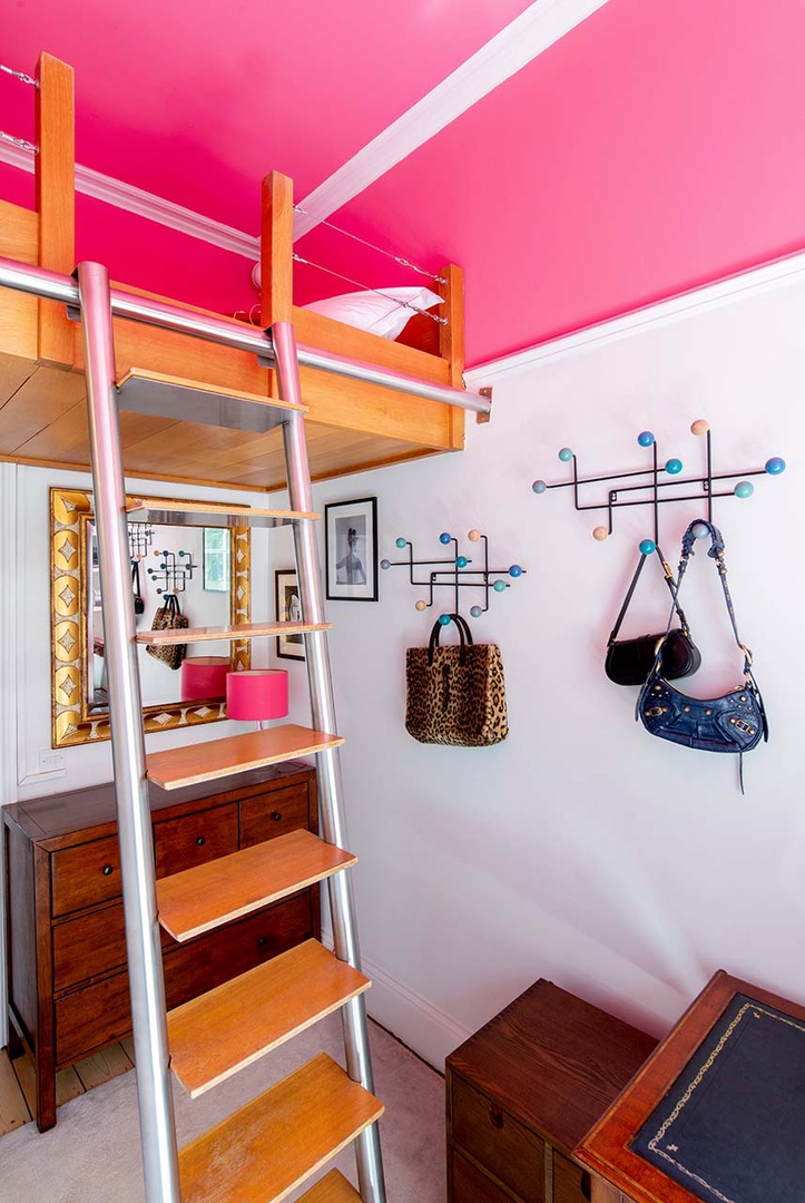 The loft bed is accessable via a ladder.