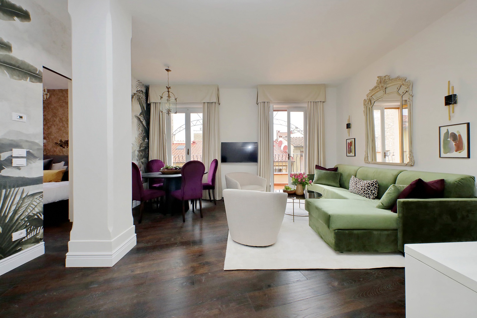 A set French doors open to the balcony from the living room.