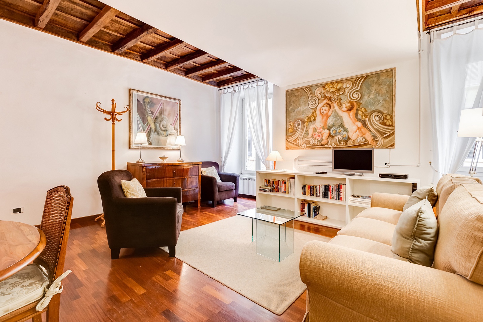 Welcoming Bellina apartment is tastefully appointed with sofa bed and two comfortable armchairs.