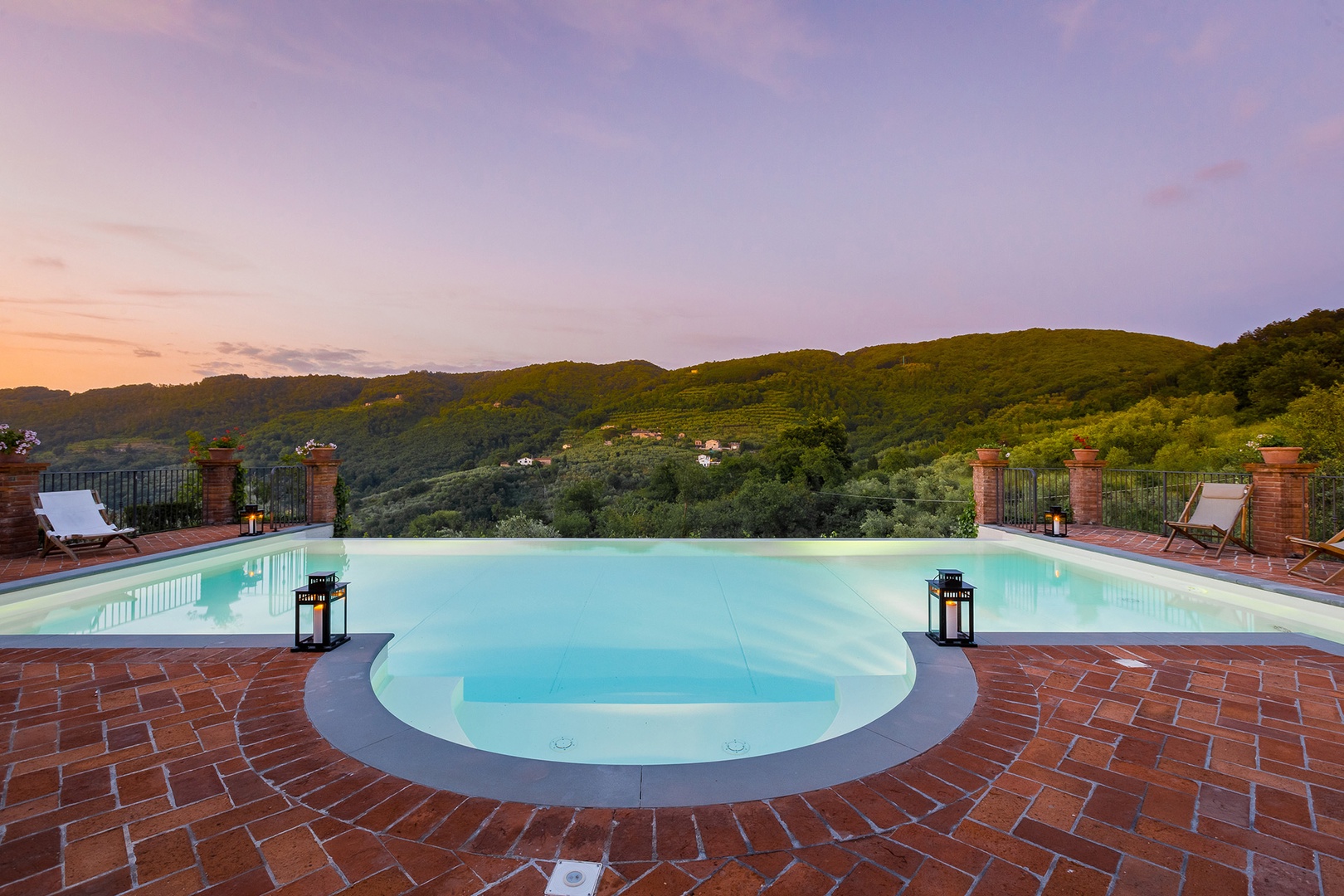 Infinity pool view of Tuscan hills.