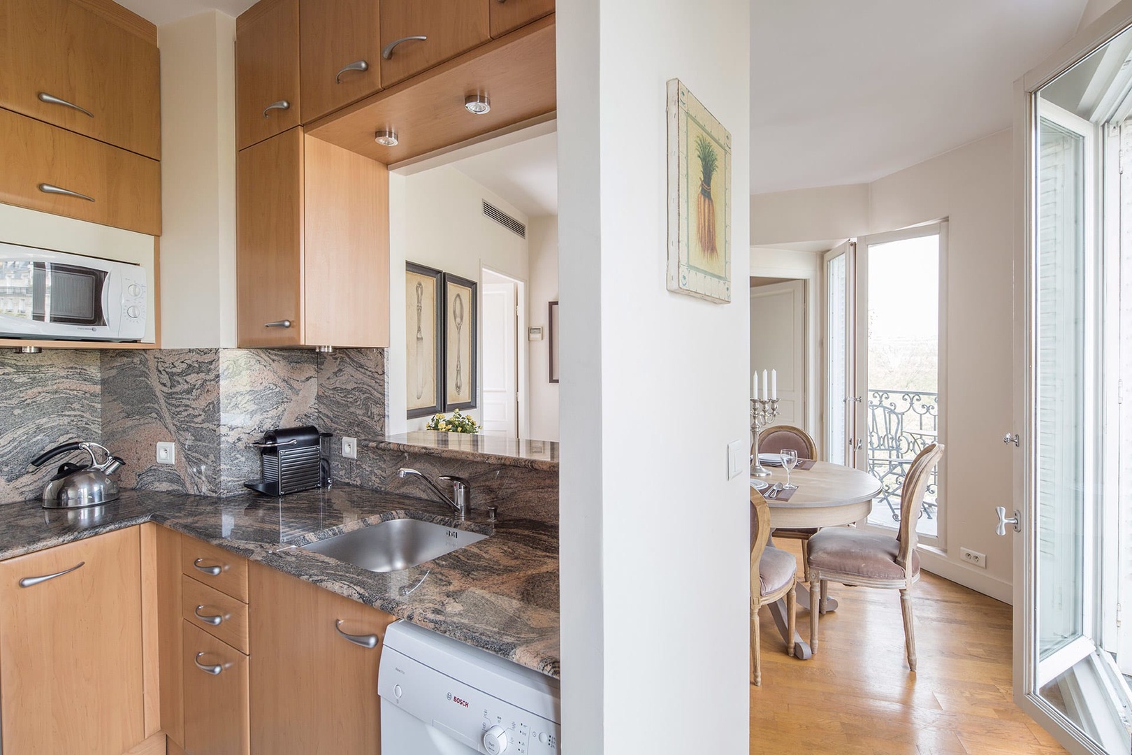 The kitchen is conveniently located next to the dining area, perfect for entertaining.