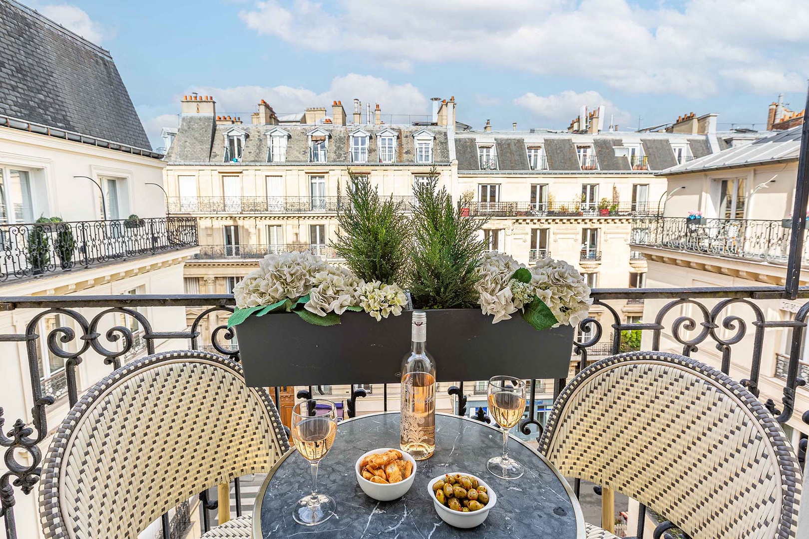 Enjoy charming moments relaxing on the balcony.