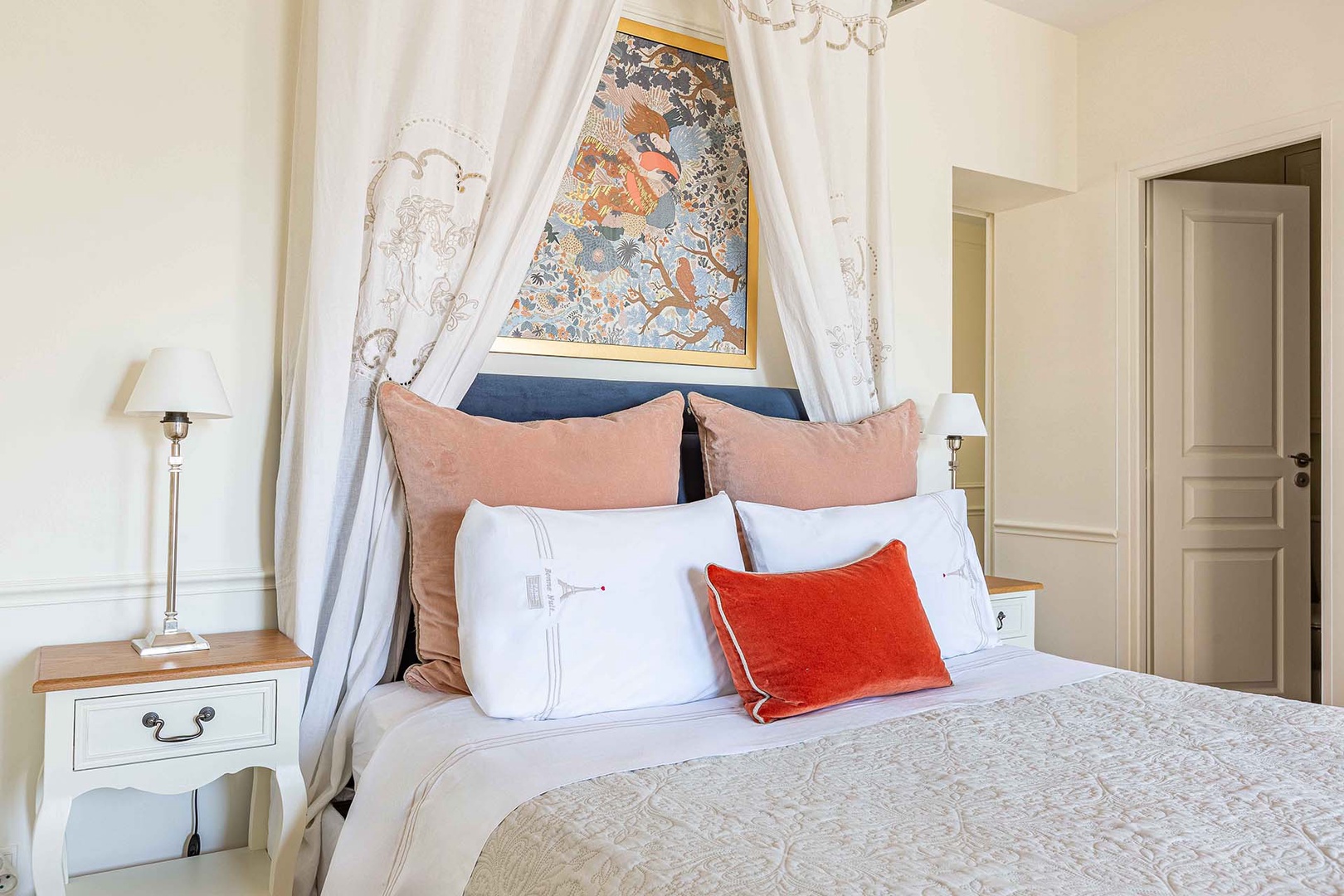 The bedroom has a romantic feel.