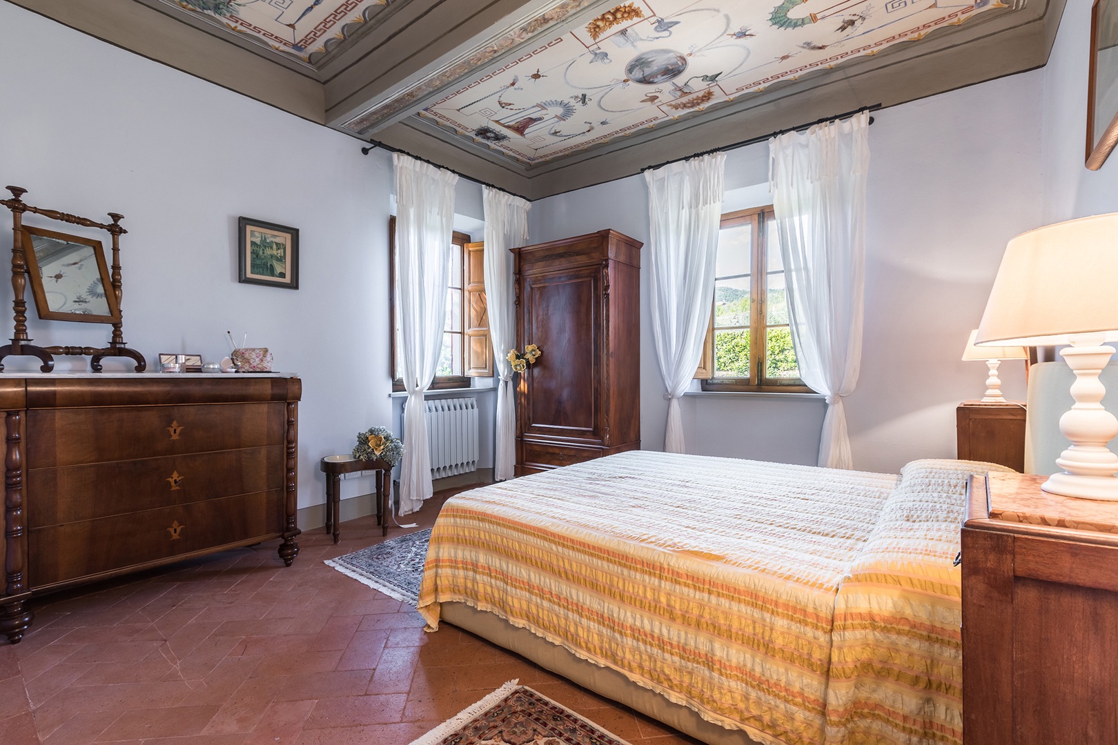 Bedroom 2 on the second floor has a beautiful frescoed ceiling and en suite bathroom.