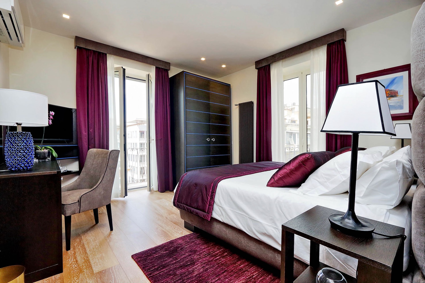 Bedroom 2 in Dolce has beautiful light from two French doors.