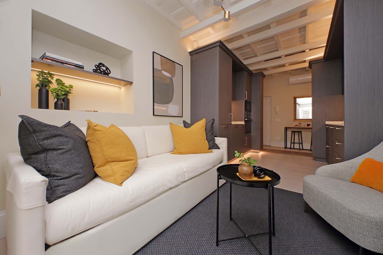 Open plan living room with kitchen and dining area.