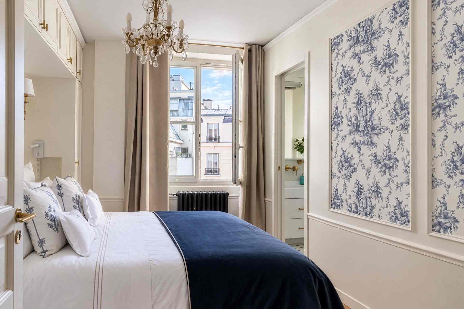 Beautifully decorated bedroom with courtyard setting.