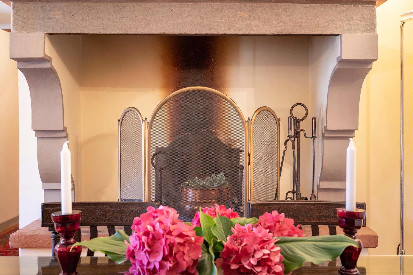 Original wood fireplace in the dining area adds character and charm.