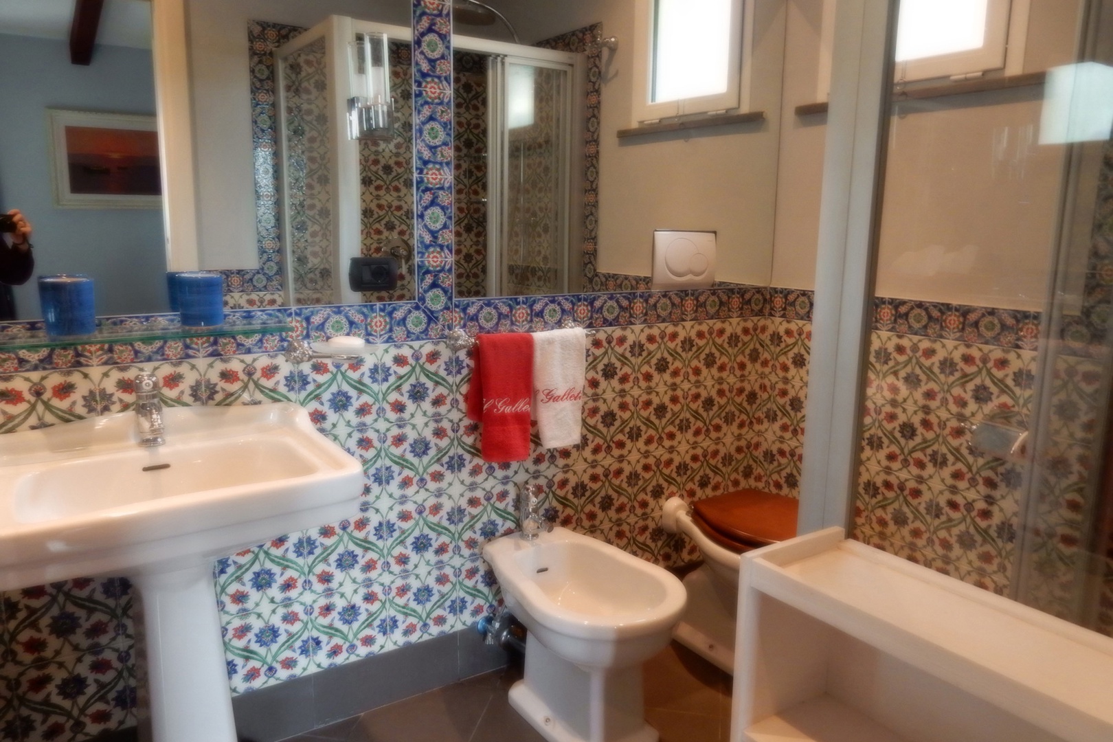 Bathroom is directly across the hall from bedroom 3. Large shower, sink, bidet and toilet.