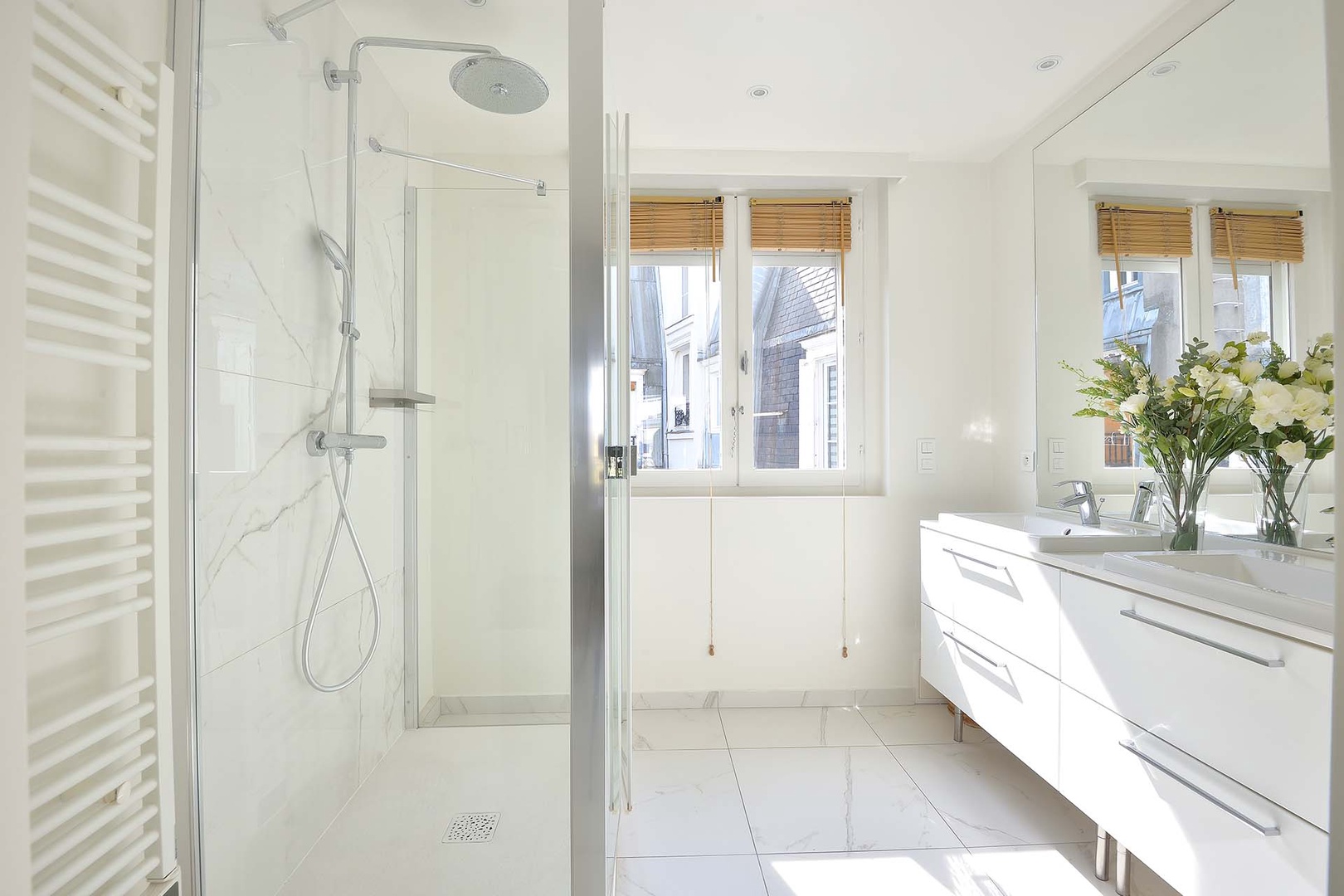 Bathroom 1 is en suite to bedroom 1 with a shower and double sink.